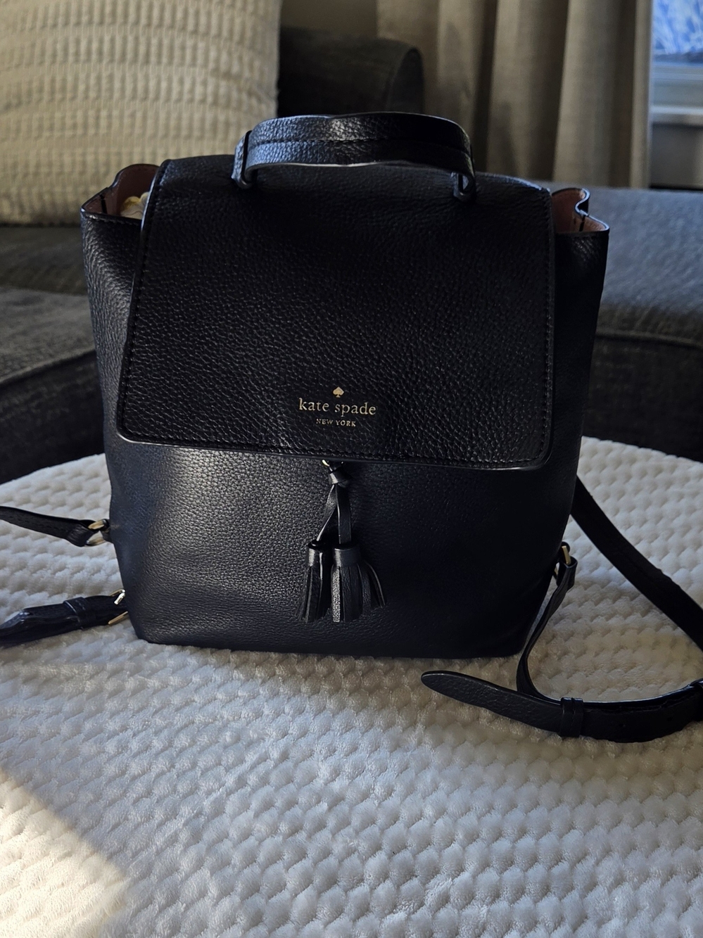 Kate Spade New York Black Pebbled Leather Flap Backpack Tassel Gold Hardware